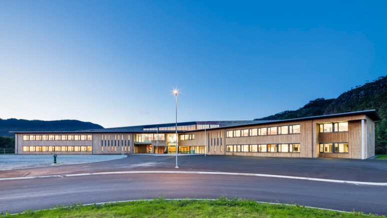 Overview of Nore Neset Skole at night, Os, Norway designed by Ramboll.