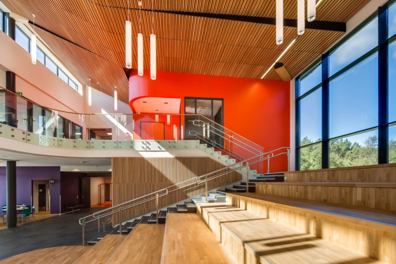 Central atrium as the last of the summer rays shines through, at Nore Neset Skole, designed by Ramboll.