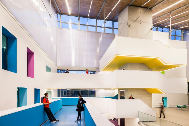 Students meeting in the central hub area North Hertforshire College designed by Scott Brownrigg, Hitchin, UK