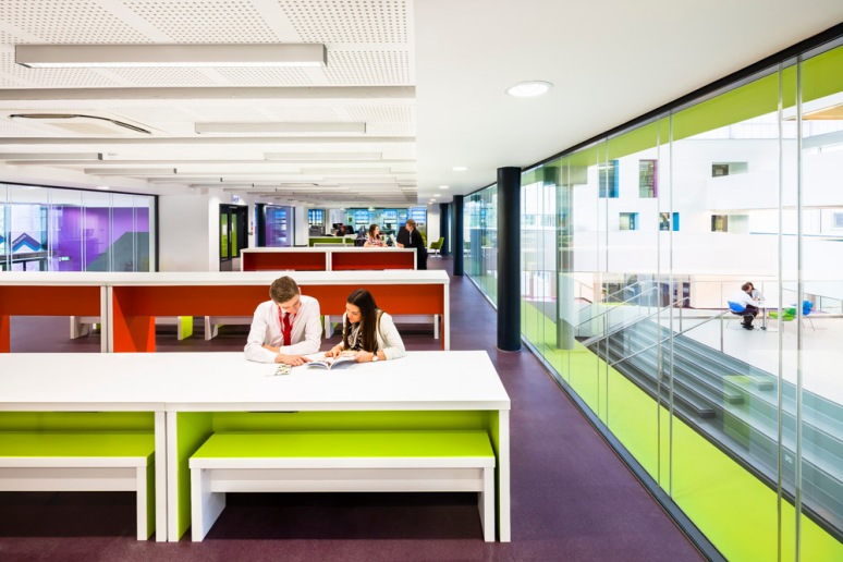 Students in one of the open plan classrooms, North Hertforshire College designed by Scott Brownrigg, Hitchin, UK