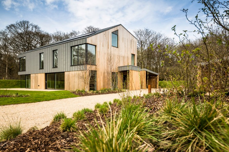 Exterior of a house at The Woods residential property designed by Scott Brownrigg, Bedfordshire, UK.