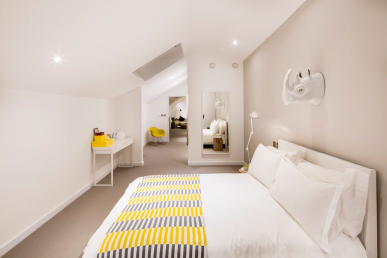 Attic bedroom at The Woods residential property designed by Scott Brownrigg, Bedfordshire, UK.