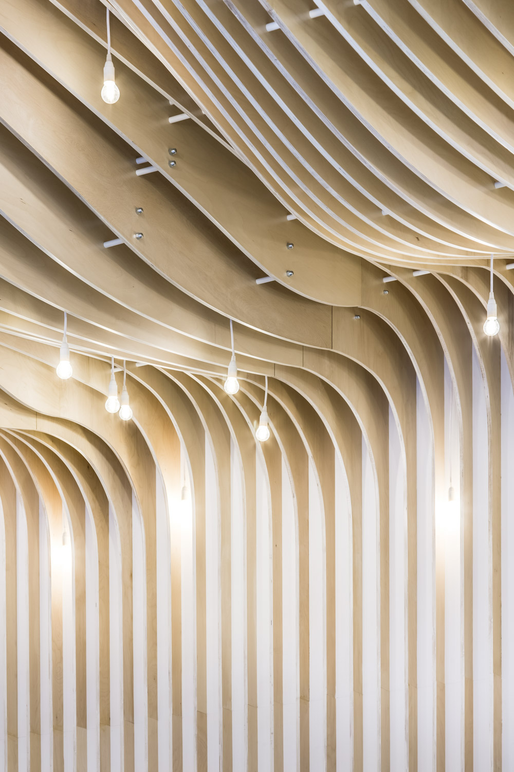 Roof flowing elegantly into the wall at 41 Eastcheap Street office, designed by Ben Adams Architects, London, UK.